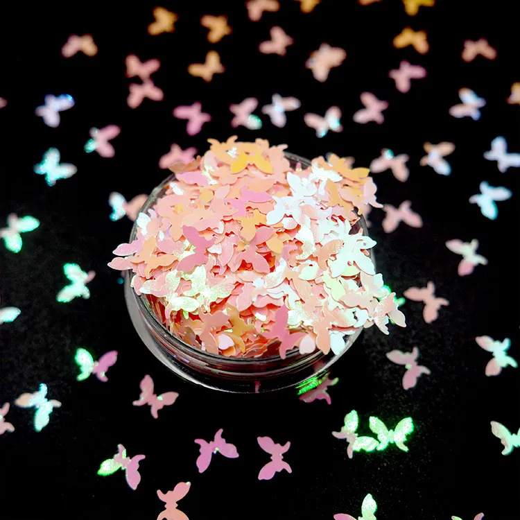 Butterfly-shaped XUCAI glitter samples for particle shape selection